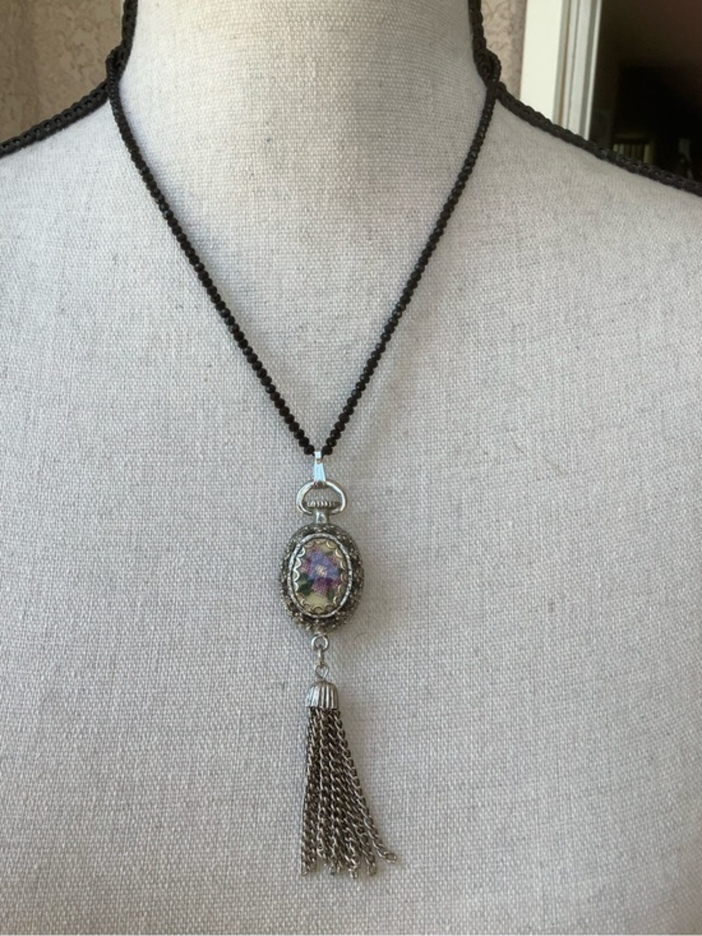 Black beaded silver tone necklace & iridescent pendant
